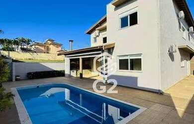 Imagem: A casa em condomínio possui 3 Dormitórios, 5 Banheiros, 350m²