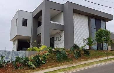 Imagem: A casa possui 4 Dormitórios, 5 Banheiros, 5 Vagas na garagem