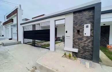 Imagem: A casa possui 3 Dormitórios, 3 Banheiros, 2 Vagas na garagem