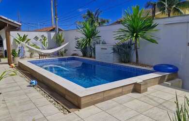 Imagem: A casa possui 3 Dormitórios, 2 Banheiros, 3 Vagas na garagem