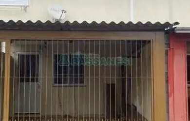Imagem: A casa possui 3 Dormitórios, 2 Banheiros, 1 Vaga na garagem