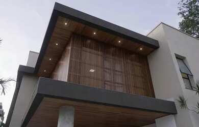 Imagem: A casa possui 4 Dormitórios, 5 Banheiros, 4 Vagas na garagem