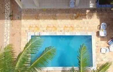 Imagem: A casa possui 3 Dormitórios, Acomodam 15 pessoas, 5 Vagas na