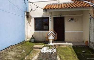 Imagem: A casa possui 2 Dormitórios, 1 Banheiro, 2 Vagas na garagem