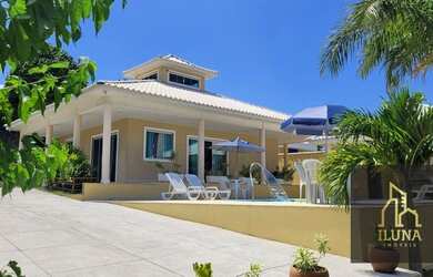 Imagem: A casa possui 5 Dormitórios, 5 Banheiros, 3 Vagas na garagem