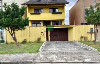 Imagem: A casa possui 3 Dormitórios, 3 Banheiros, 3 Vagas na garagem