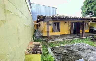 Imagem: A casa possui 3 Dormitórios, 3 Banheiros, 5 Vagas na garagem