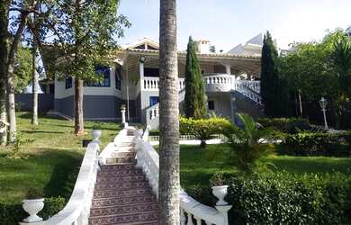 Imagem: A casa em condomínio à venda possui 4 Dormitórios, 5 Banheiros