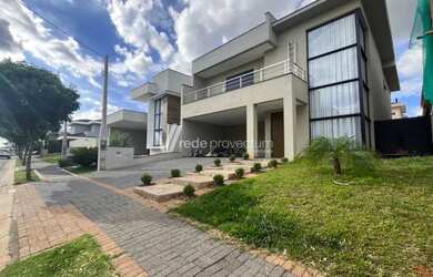 Imagem: A casa em condomínio e possui 4 Dormitórios, Suítes, 5 Banheiros