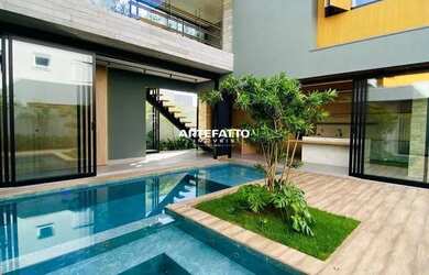 Imagem: A casa possui 4 Dormitórios, 5 Banheiros, 4 Vagas na garagem