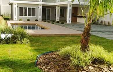 Imagem: A casa possui 4 Dormitórios, 5 Banheiros, 5 Vagas na garagem