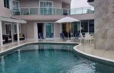 Imagem: A casa possui 5 Dormitórios, 5 Banheiros, 4 Vagas na garagem