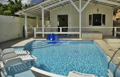 Imagem: A casa possui 5 Dormitórios, 3 Banheiros, 4 Vagas na garagem