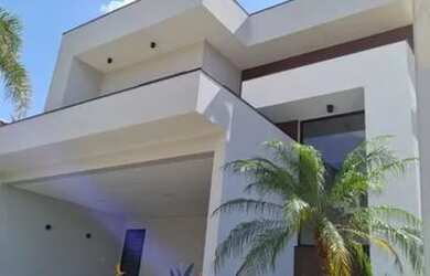 Imagem: A casa possui 4 Dormitórios, 5 Banheiros, 4 Vagas na garagem