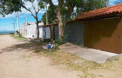 Imagem: A casa possui 3 Dormitórios, 3 Banheiros, 3 Vagas na garagem