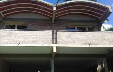 Imagem: A casa possui 5 Dormitórios, 4 Banheiros, 5 Vagas na garagem