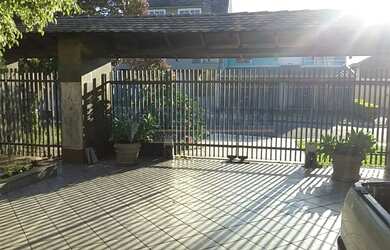 Imagem: A casa possui 5 Dormitórios, 5 Banheiros, 3 Vagas na garagem