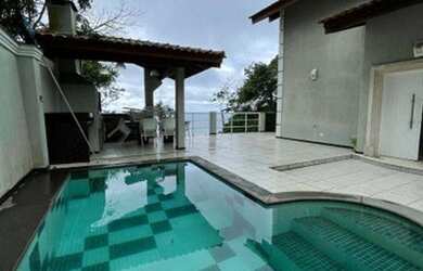 Imagem: A casa possui 3 Dormitórios, 5 Banheiros, 5 Vagas na garagem