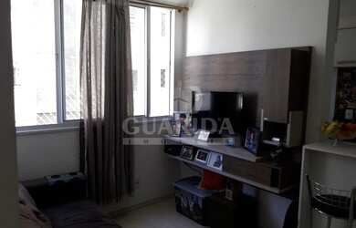 Imagem: O apartamento possui 2 Dormitórios, 1 Banheiro, 1 Vaga na garagem