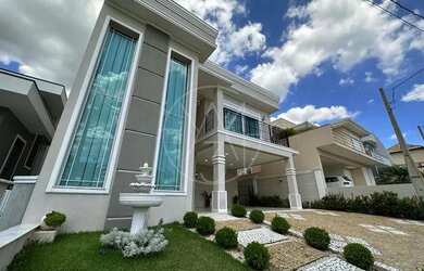 Imagem: A casa em condomínio e possui 4 Dormitórios, Suítes, 5 Banheiros