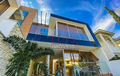 Imagem: A casa possui 3 Dormitórios, 4 Banheiros, 3 Vagas na garagem