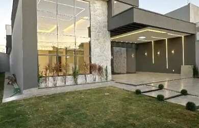 Imagem: A casa possui 4 Dormitórios, 5 Banheiros, 4 Vagas na garagem