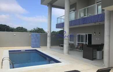 Imagem: A casa em condomínio possui 5 Dormitórios, 5 Banheiros, 5