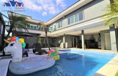 Imagem: A casa possui 4 Dormitórios, 5 Banheiros, 5 Vagas na garagem