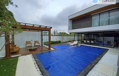 Imagem: A casa em condomínio possui 4 Dormitórios, 5 Banheiros, 4