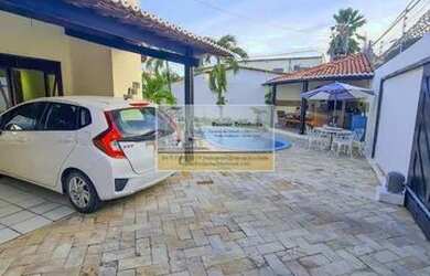 Imagem: A casa possui 2 Dormitórios, 5 Banheiros, 3 Vagas na garagem