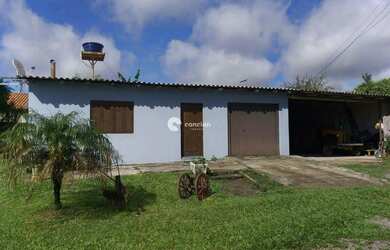 Imagem: A casa possui 2 Dormitórios, 1 Banheiro, 2 Vagas na garagem