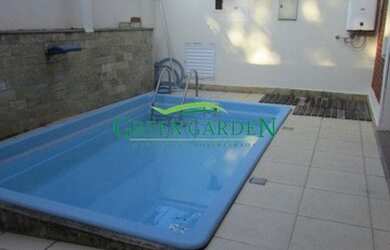 Imagem: A casa possui 5 Dormitórios, 4 Banheiros, 4 Vagas na garagem