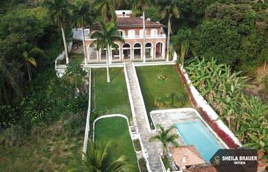 Imagem: A casa possui 5 Dormitórios, 5 Banheiros, 5 Vagas na garagem