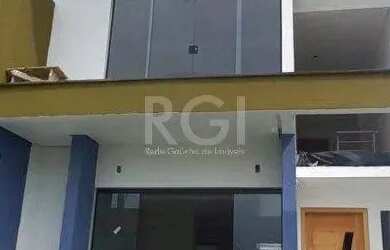 Imagem: A casa possui 3 Dormitórios, 3 Banheiros, 2 Vagas na garagem