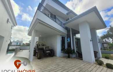 Imagem: A casa em condomínio possui 4 Dormitórios, 5 Banheiros, 2