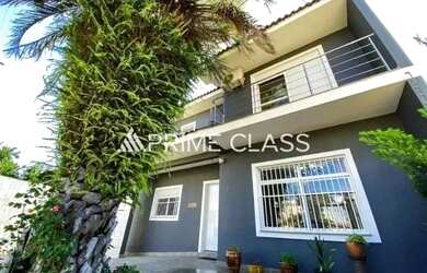 Imagem: A casa possui 5 Dormitórios, 4 Banheiros, 3 Vagas na garagem