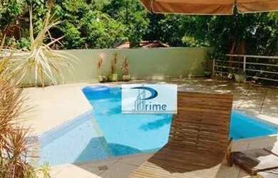 Imagem: A casa em condomínio possui 4 Dormitórios, 4 Banheiros, 600m²