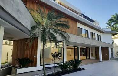 Imagem: A casa possui 4 Dormitórios, 5 Banheiros, 5 Vagas na garagem