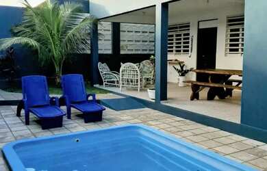 Imagem: A casa possui 5 Dormitórios, 2 Banheiros, 5 Vagas na garagem