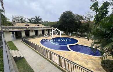 Imagem: A casa em condomínio possui 2 Dormitórios, 5 Banheiros, 4