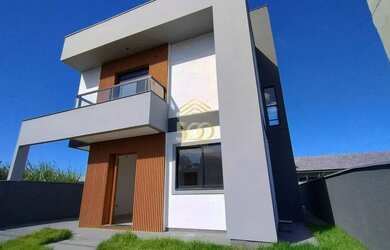 Imagem: A casa possui 3 Dormitórios, 2 Banheiros, 2 Vagas na garagem