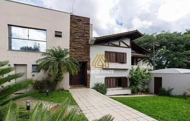 Imagem: A casa possui 3 Dormitórios, 5 Banheiros, 5 Vagas na garagem