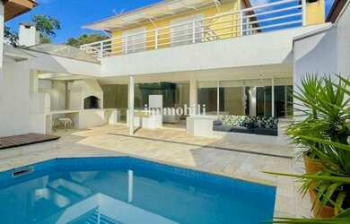 Imagem: A casa possui 4 Dormitórios, 4 Banheiros, 2 Vagas na garagem