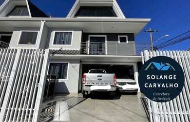 Imagem: A casa possui 3 Dormitórios, 3 Banheiros, 2 Vagas na garagem