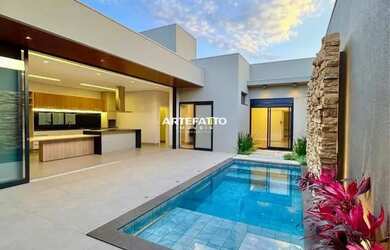 Imagem: A casa possui 3 Dormitórios, 4 Banheiros, 3 Vagas na garagem