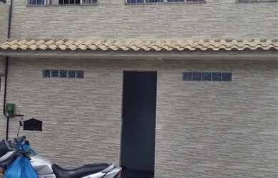 Imagem: A casa possui 3 Dormitórios, 2 Banheiros, Churrasqueira e está