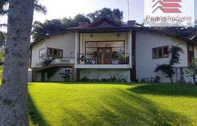 Imagem: A casa em condomínio possui 4 Dormitórios, 5 Banheiros, 4