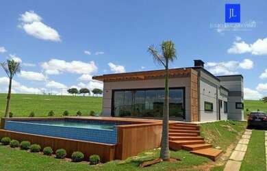 Imagem: A casa em condomínio possui 3 Dormitórios, 3 Banheiros e 220m²