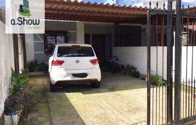 Imagem: A casa possui 2 Dormitórios, 1 Banheiro, 2 Vagas na garagem