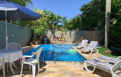 Imagem: A casa possui 4 Dormitórios, 4 Banheiros, 4 Vagas na garagem